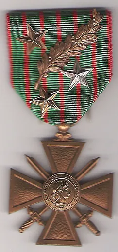 Croix de guerre 1914-1918 dont le ruban porte une palme de bronze et trois étoiles